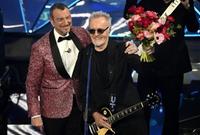 Sanremo Festival host and artistic director Amadeus (L) and Italian singer Umberto Tozzi the Ariston theatre during the 74th Sanremo Italian Song Festival in Sanremo, Italy, 09 February 2024. The music festival runs from 06 to 10 February 2024.   ANSA/RICCARDO ANTIMIANI/POOL